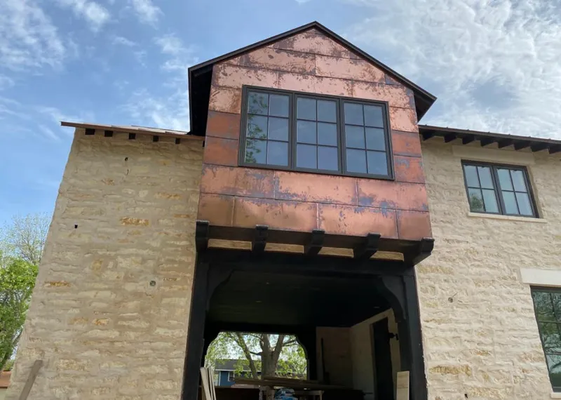Copper metal panel facade on a stone building for Roof Repair in East Hempfield